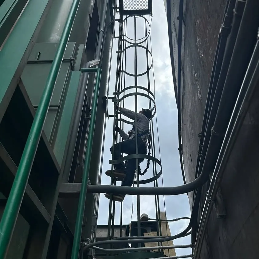 Climbing a grain elevator in Aledo to wire lights 200 feet up