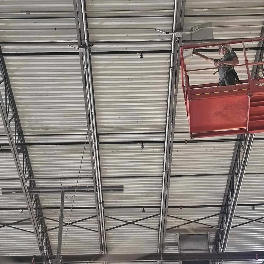 Wiring high-capacity fans from a lift in an Arlington warehouse
