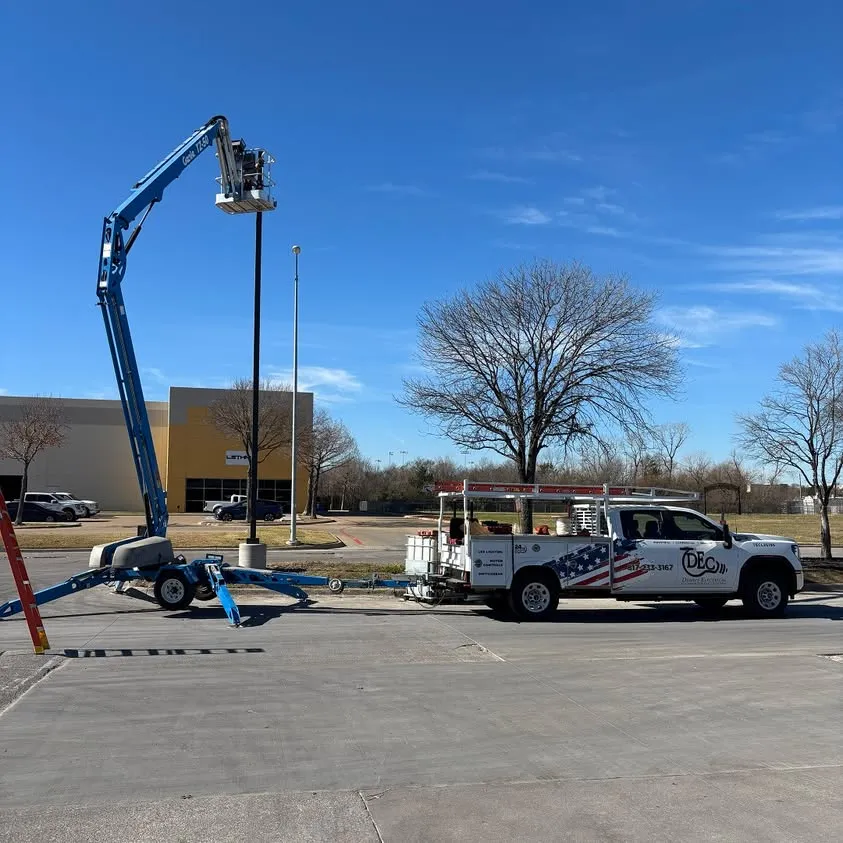 Installing parking lot lighting from a sky lift in Dallas